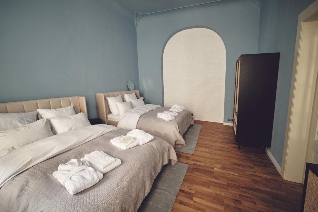 Postel nebo postele na pokoji v ubytování Domus Balthasar Boutique Hotel