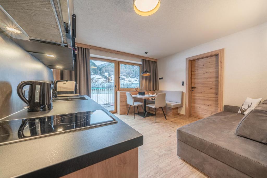 Kuchyňa alebo kuchynka v ubytovaní Bergmomente Apartments