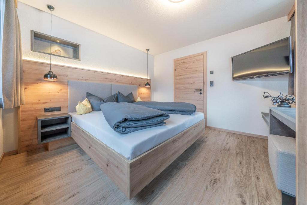 Posteľ alebo postele v izbe v ubytovaní Bergmomente Apartments