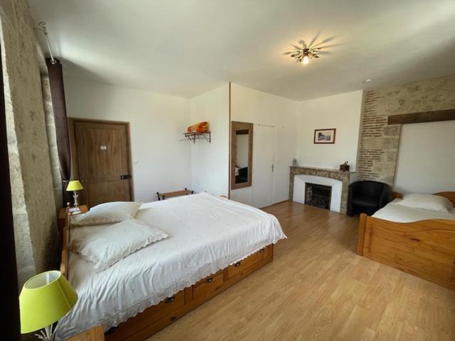 Postel nebo postele na pokoji v ubytování Le relais de Mantelot