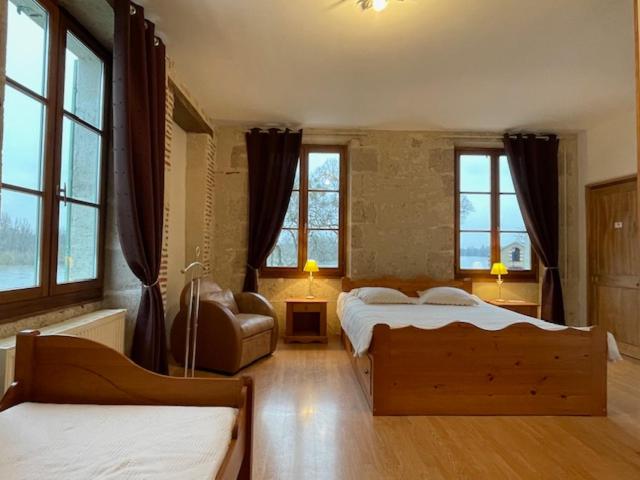 Postel nebo postele na pokoji v ubytování Le relais de Mantelot