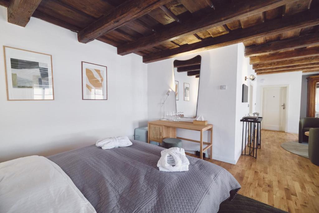 Postel nebo postele na pokoji v ubytování Domus Balthasar Boutique Hotel
