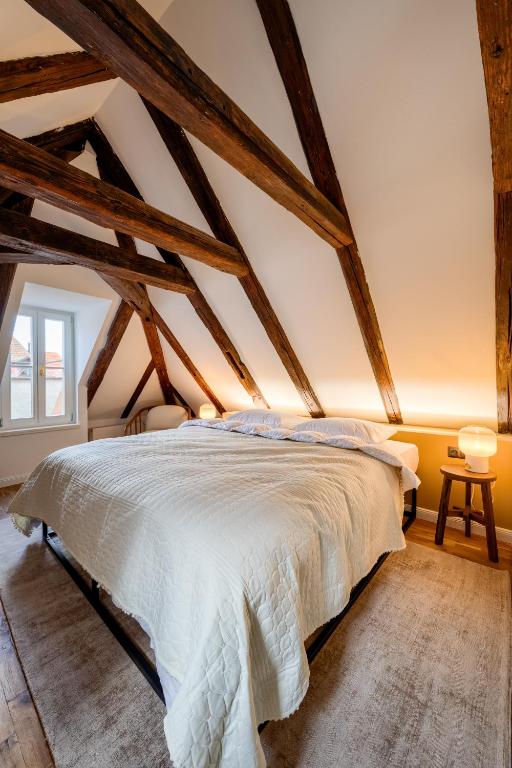 Postel nebo postele na pokoji v ubytování Domus Balthasar Boutique Hotel