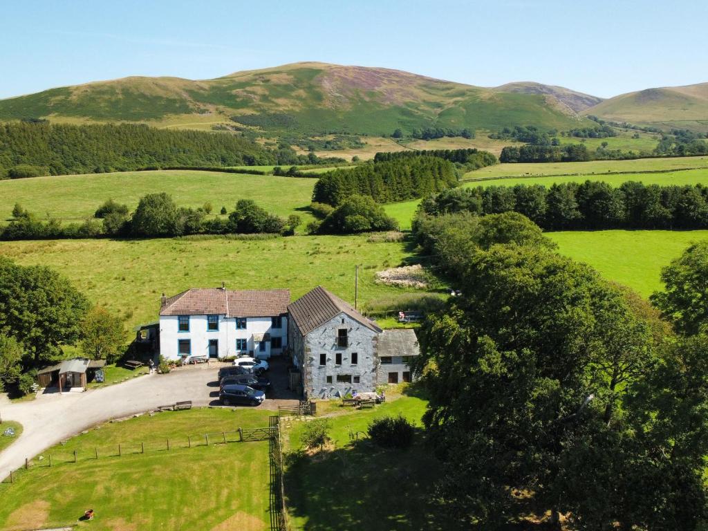 an aerial view of a house in the hills at Kestrel Cottage in Keswick