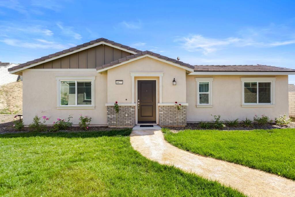 a house with a green lawn in front of it at Entire Guesthouse for Rent in San Bernardino in San Bernardino