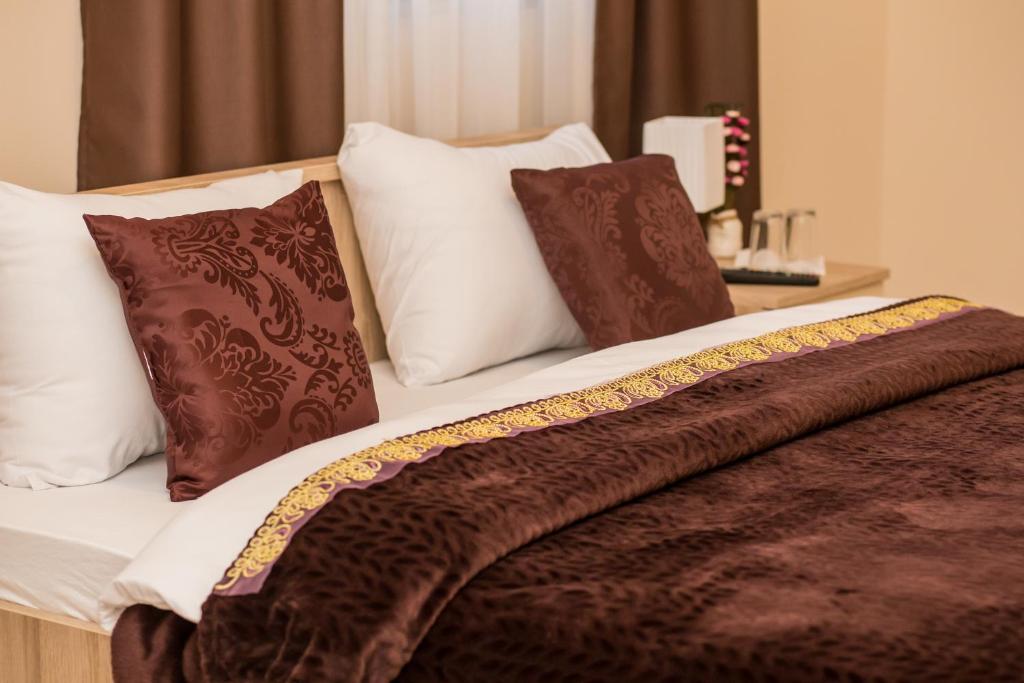 Postel nebo postele na pokoji v ubytování Hotel Hana