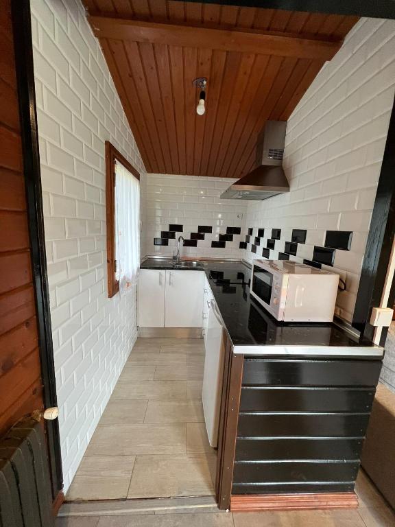 Kuchyň nebo kuchyňský kout v ubytování Cabaña de Caldones