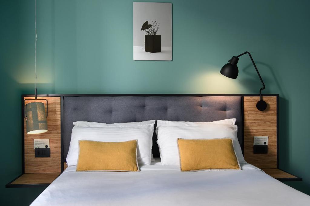 Letto o letti in una camera di The Poet Hotel