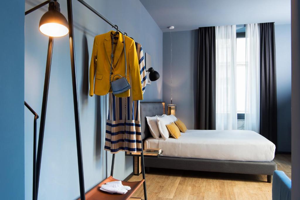 Letto o letti in una camera di The Poet Hotel