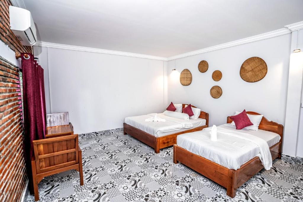Postel nebo postele na pokoji v ubytování Bat Rice Resort