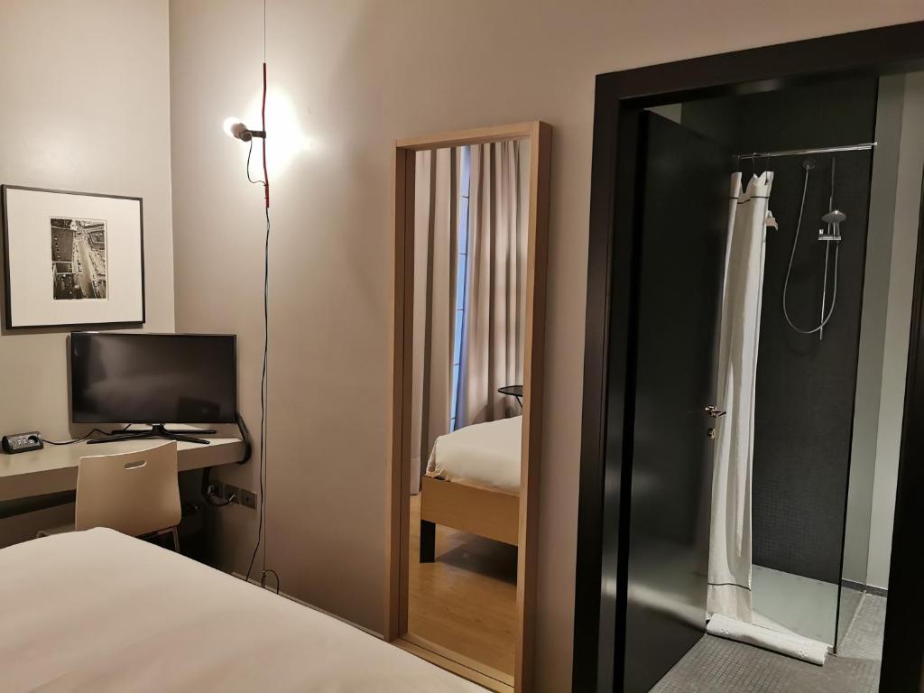 Postel nebo postele na pokoji v ubytování Hotel Casa Poli
