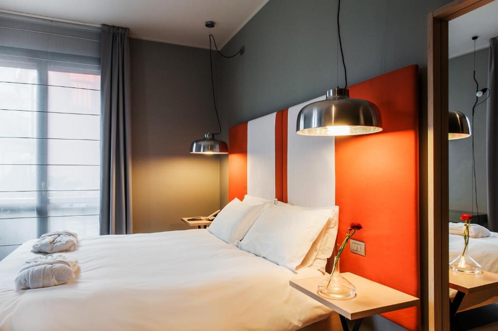Postel nebo postele na pokoji v ubytování Hotel Casa Poli