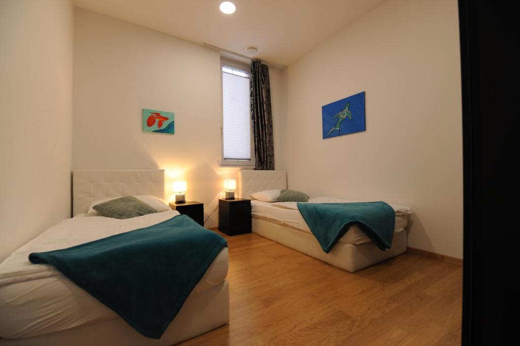 Postel nebo postele na pokoji v ubytování Argo Apartments