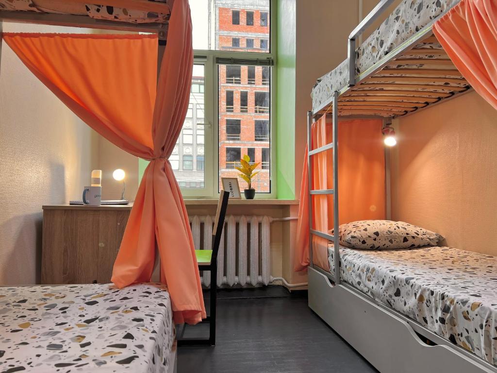 Ліжко або ліжка в номері Amely Hostel