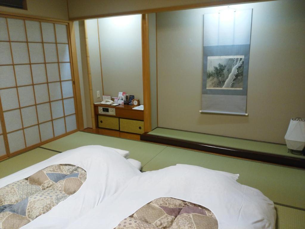Postel nebo postele na pokoji v ubytování JR Hotel Clement Tokushima