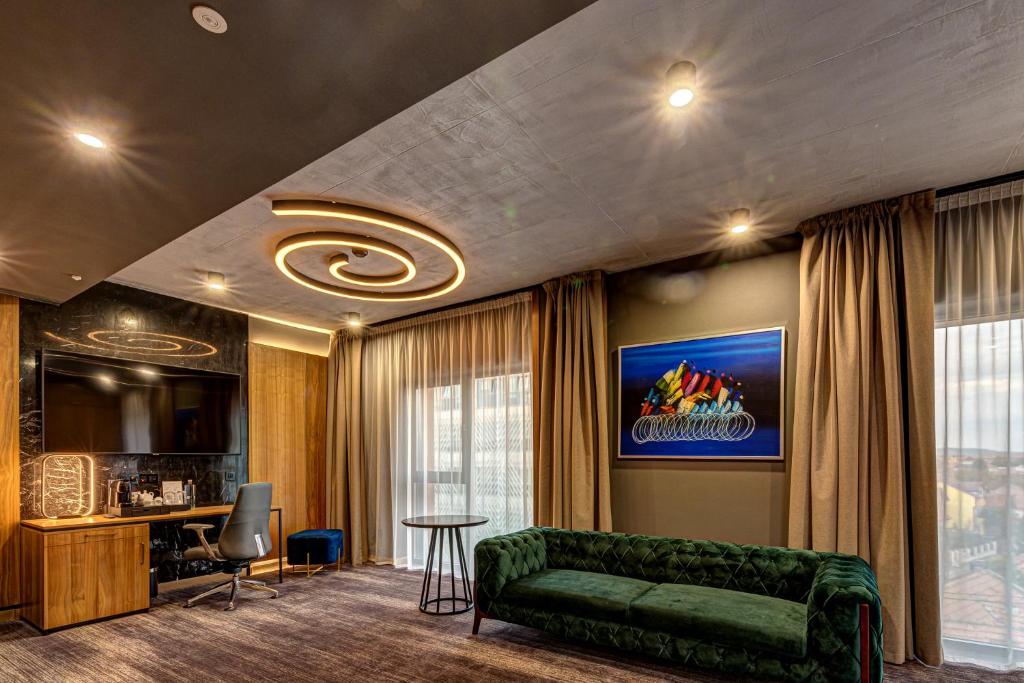 TV a/nebo společenská místnost v ubytování Hotel Vibre
