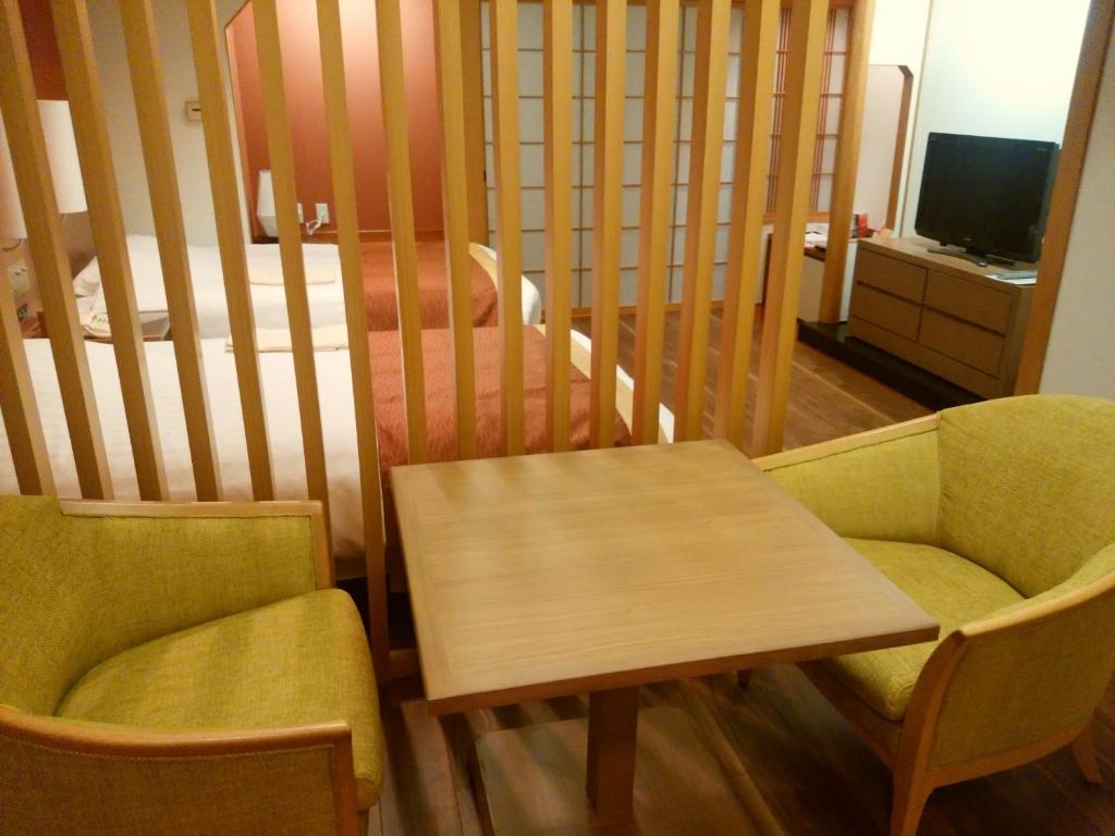 TV a/nebo společenská místnost v ubytování JR Hotel Clement Tokushima