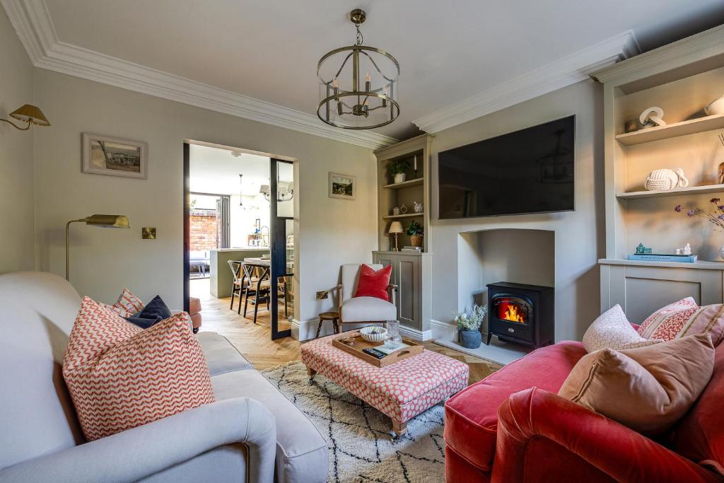 a living room with two couches and a fire place at *NEW* Little Pyecroft House, Chester in Chester
