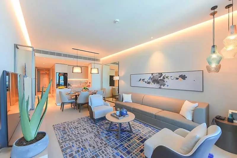 a living room with a couch and chairs and a table at 1 BEDROOM ADDRESS BEACH FRONT JBR in Dubai