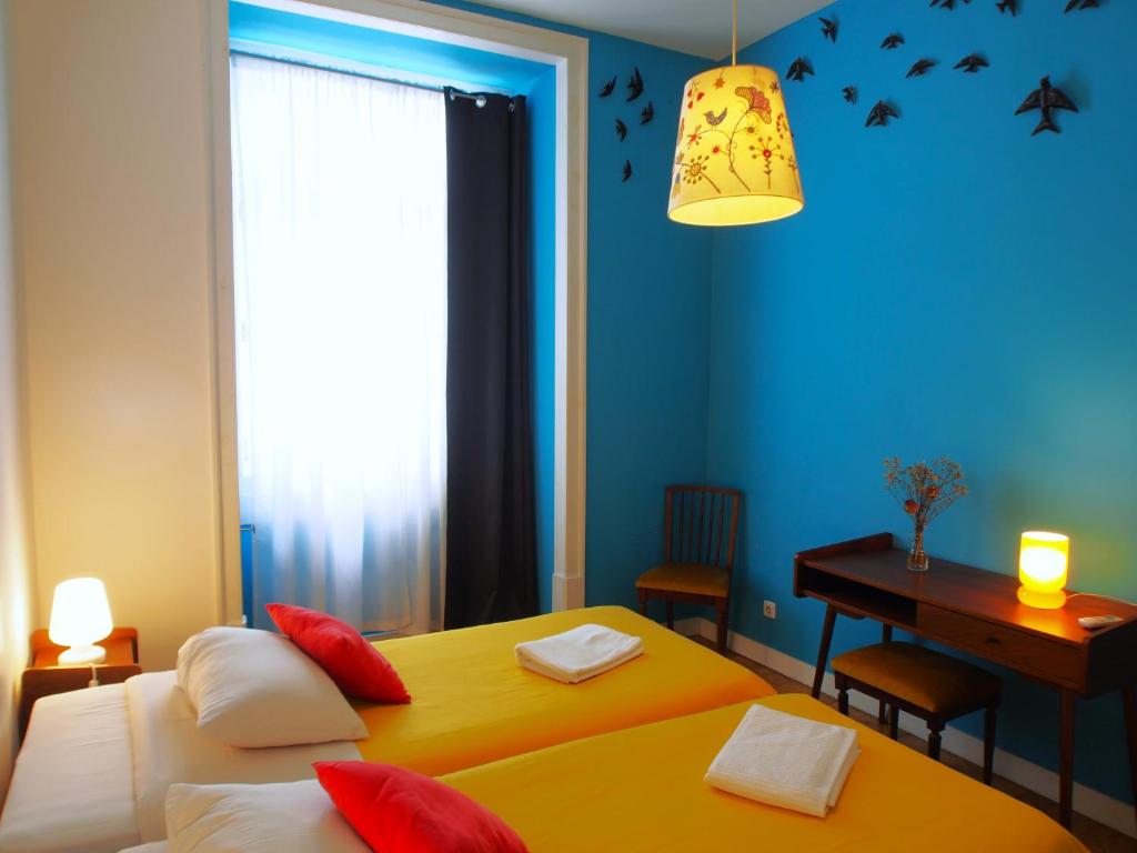Postel nebo postele na pokoji v ubytování Living Lounge Hostel