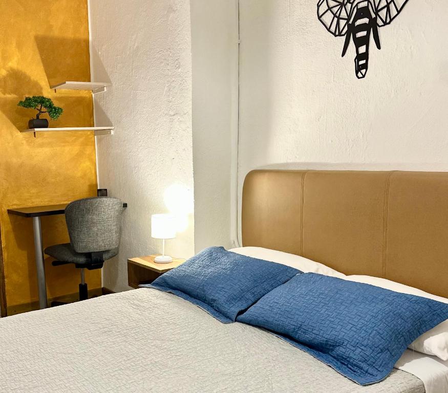 Postel nebo postele na pokoji v ubytování Hotel Casa Lucca