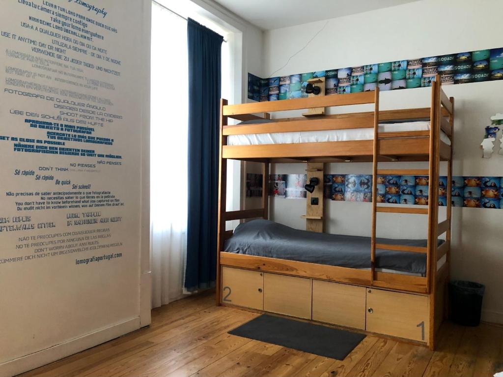 Postel nebo postele na pokoji v ubytování Living Lounge Hostel