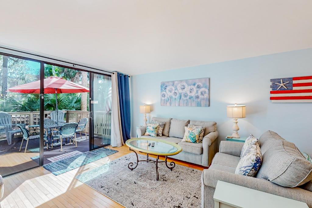 a living room with a couch and a table at Seascape Villas, Unit 3239 in Hilton Head Island