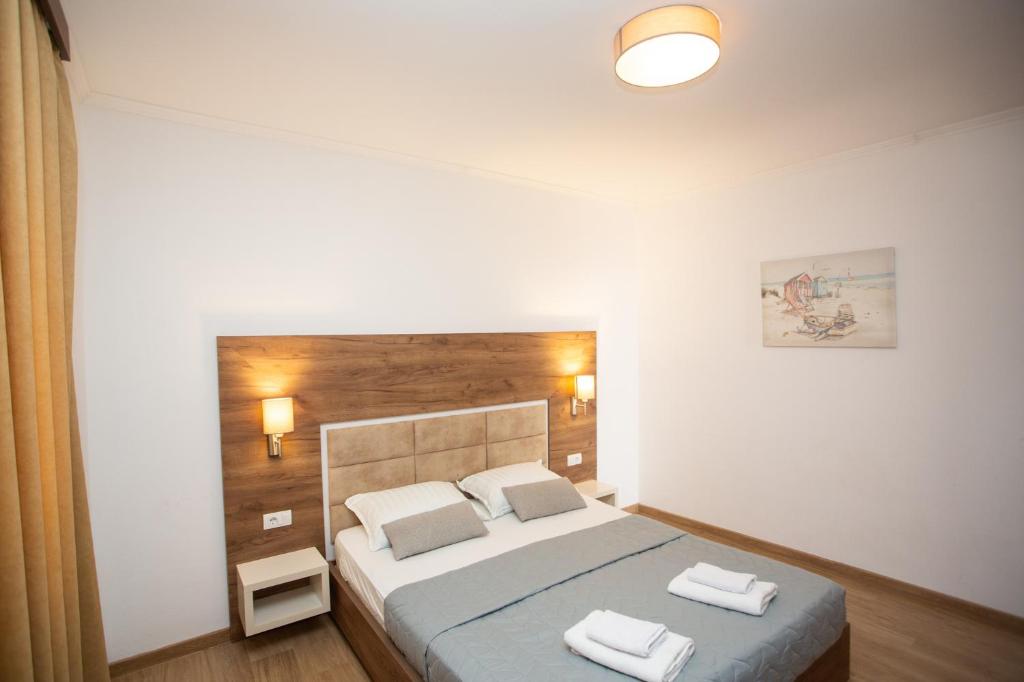 Postel nebo postele na pokoji v ubytování Apartments Bogojevic