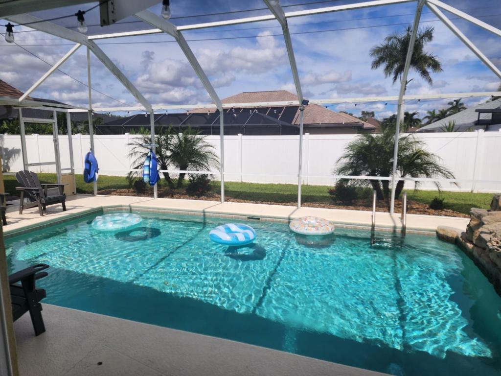 a large swimming pool with blue water at Casa in The Cove in Cape Coral