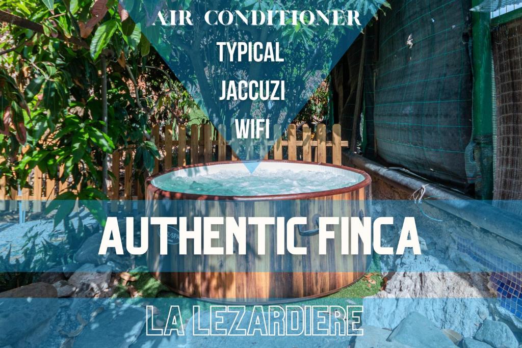 un anuncio de una boca de incendios artificial en un jardín en Lodge Nature in quiet Montain - Private Jaccuzi and garden, Wifi - La Lézardière, en San Bartolomé