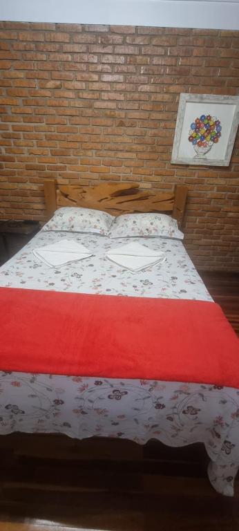 Łóżko lub łóżka w pokoju w obiekcie COYOTE POUSADA&HOSTEL