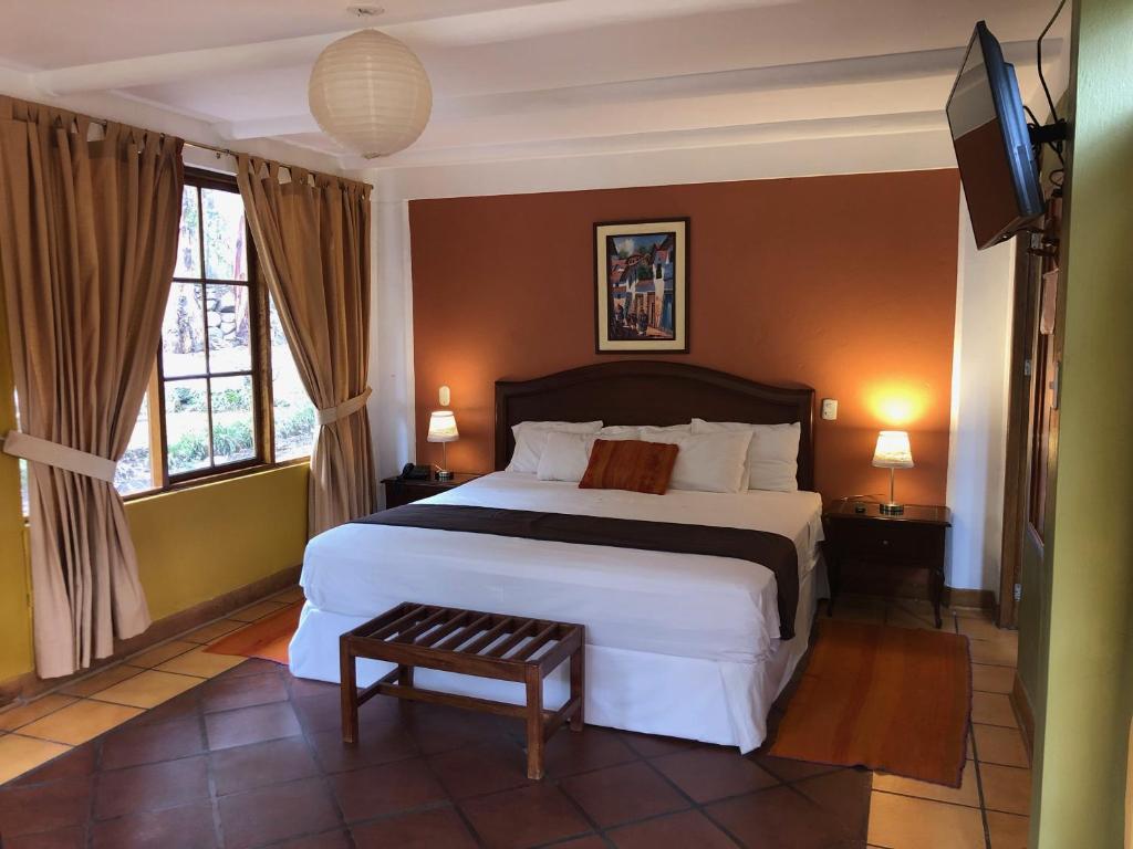 Postel nebo postele na pokoji v ubytování Hotel Pisonay Pueblo