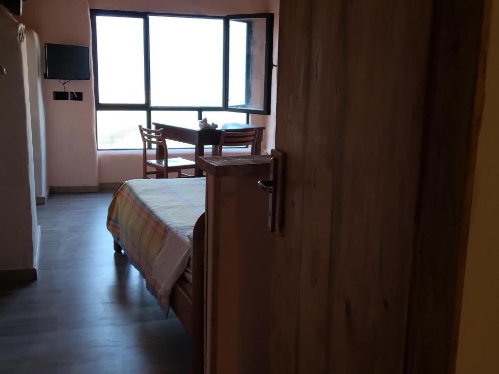 Postel nebo postele na pokoji v ubytování casa tarcisio