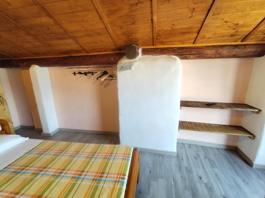 Postel nebo postele na pokoji v ubytování casa tarcisio