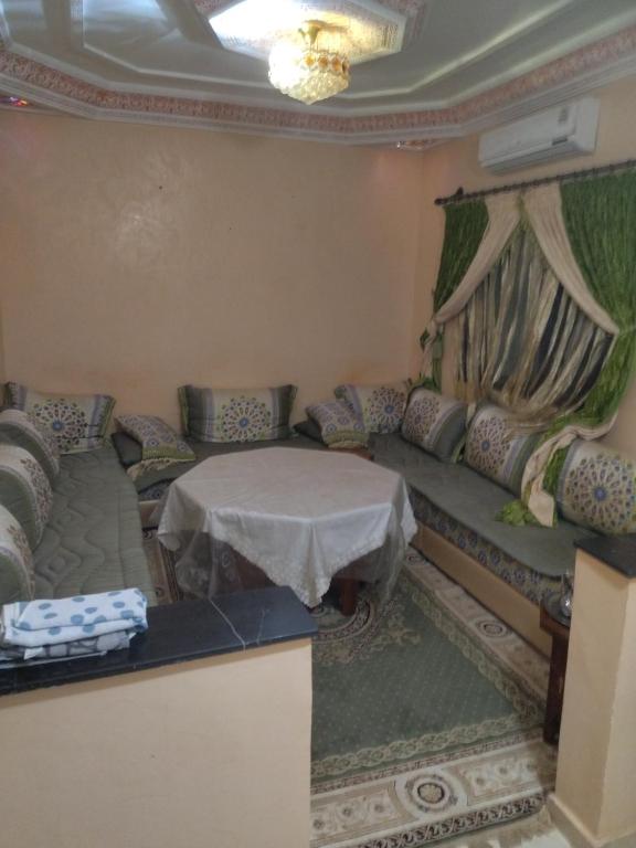 a living room with a couch and a table at مراكش in Marrakesh