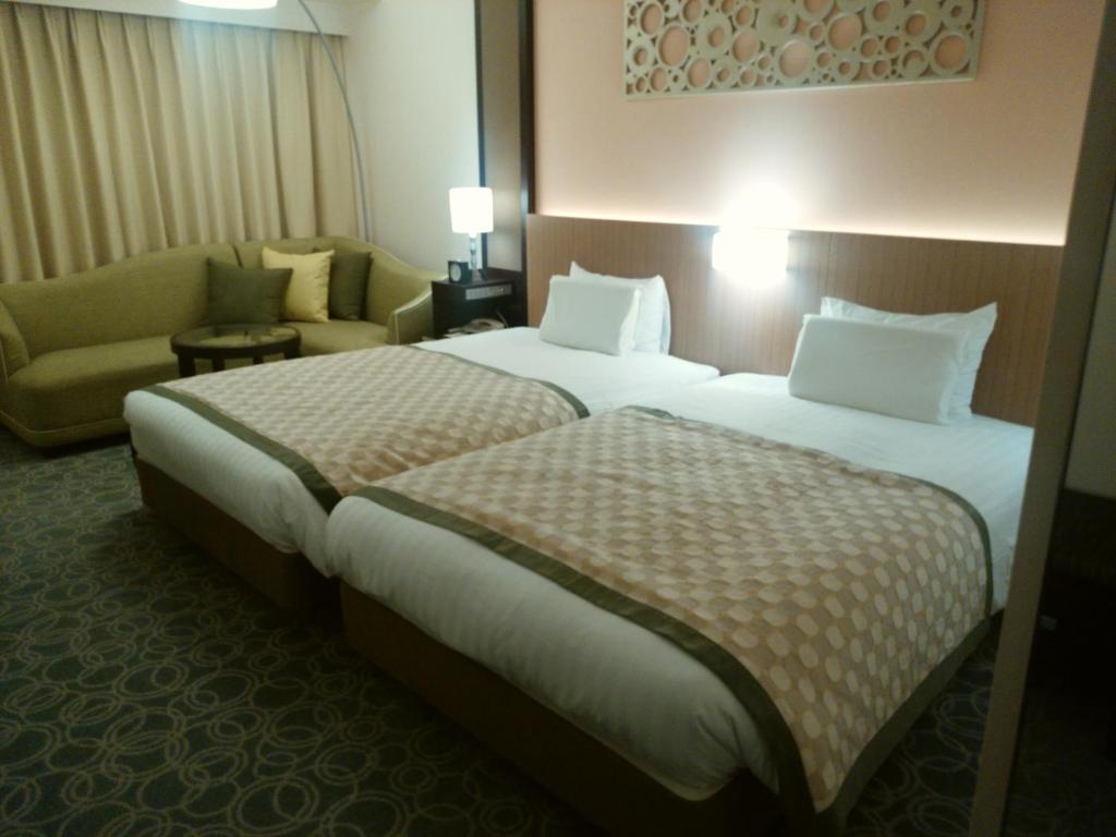Postel nebo postele na pokoji v ubytování JR Hotel Clement Tokushima