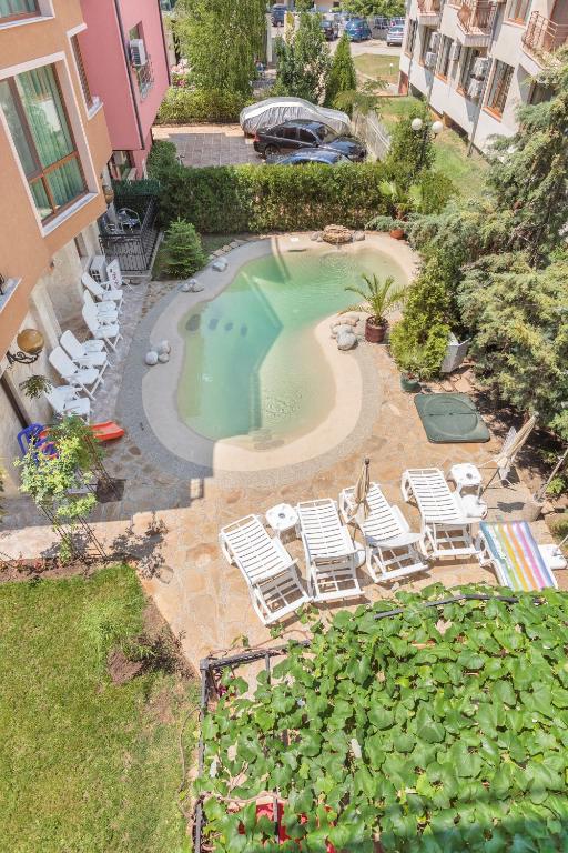 an overhead view of a swimming pool with lawn chairs at Villa Brigantina in Sunny Beach