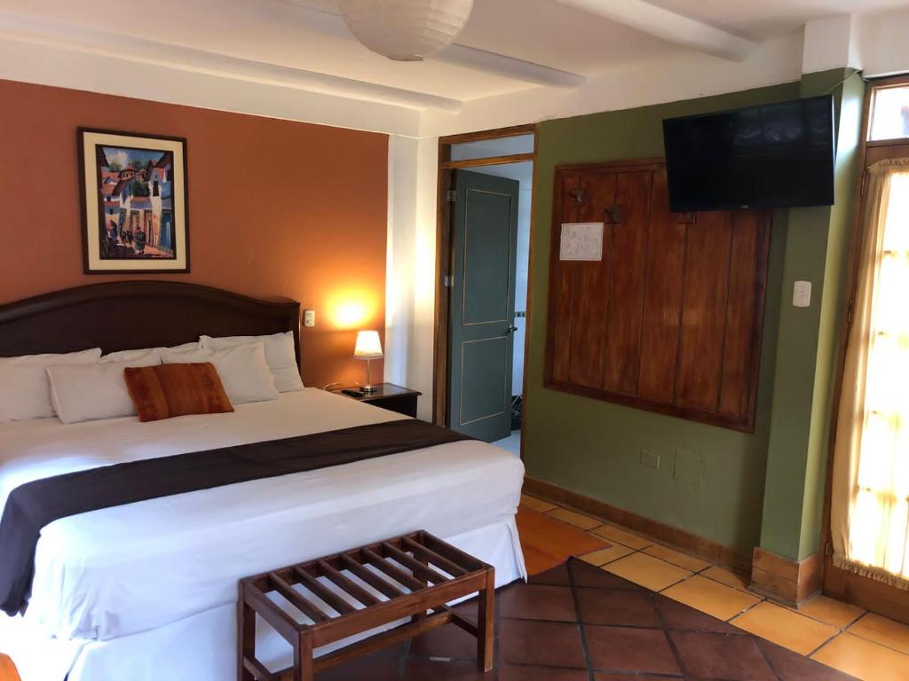 Postel nebo postele na pokoji v ubytování Hotel Pisonay Pueblo
