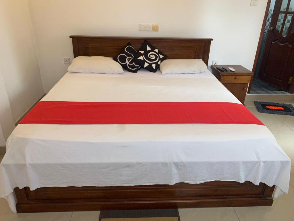 Postel nebo postele na pokoji v ubytování JJ VILLA ALUTHGAMA