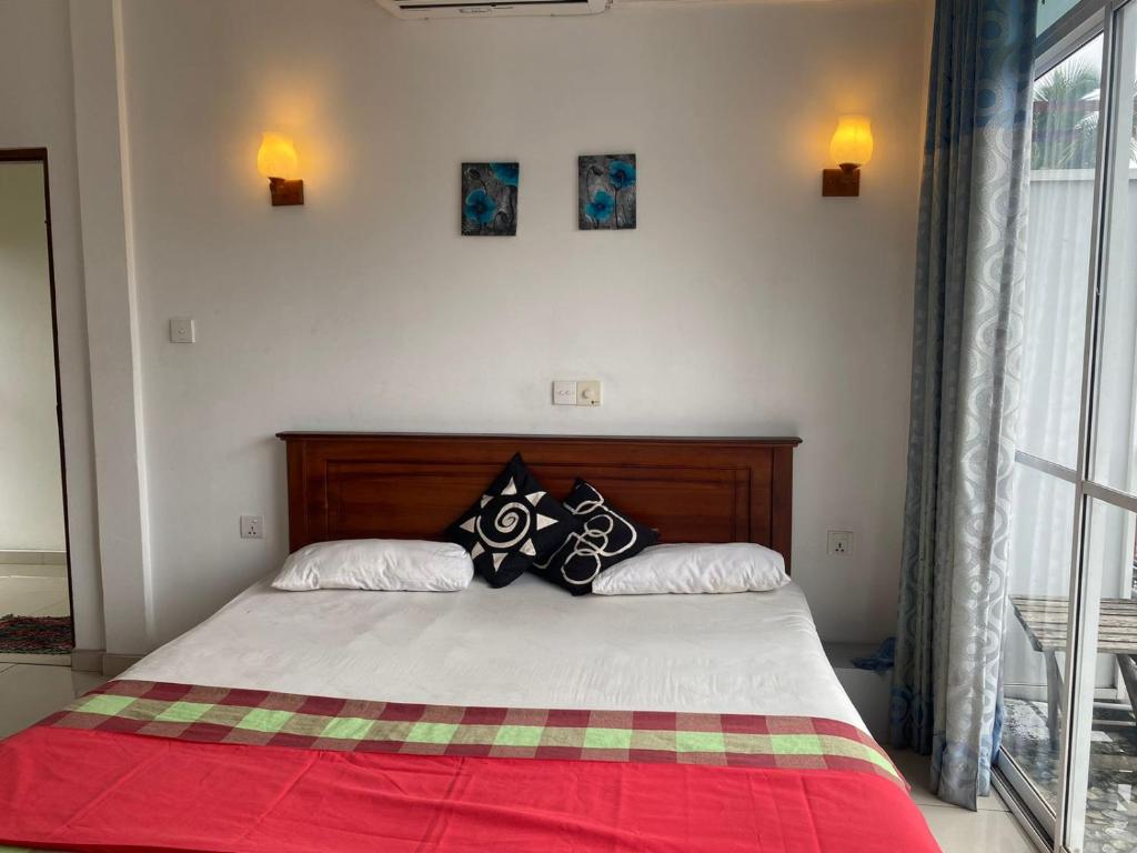 Postel nebo postele na pokoji v ubytování JJ VILLA ALUTHGAMA