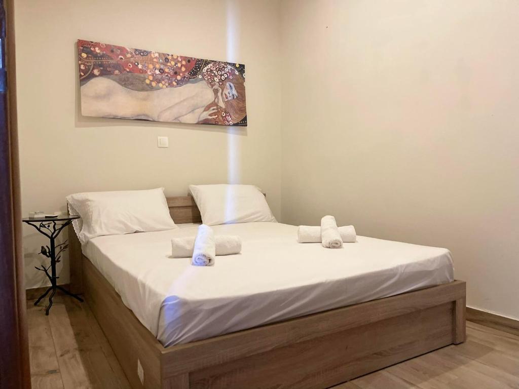 Postel nebo postele na pokoji v ubytování kalos house