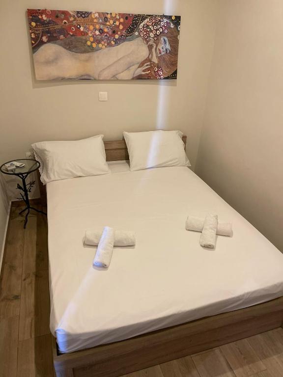Postel nebo postele na pokoji v ubytování kalos house