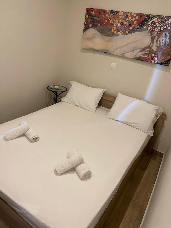 Postel nebo postele na pokoji v ubytování kalos house