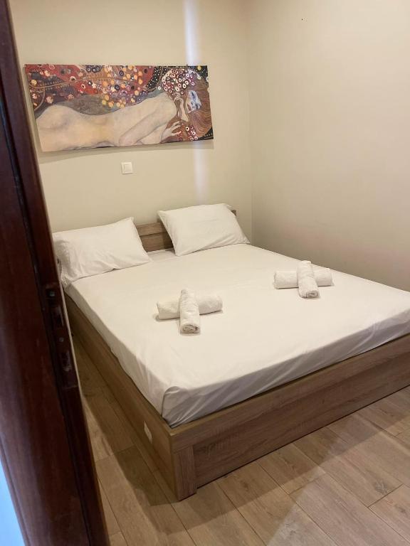 Postel nebo postele na pokoji v ubytování kalos house