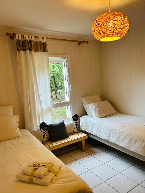 Postel nebo postele na pokoji v ubytování Gîte Ethic Simple & Chic