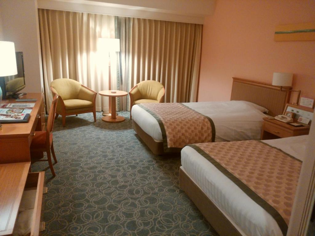Postel nebo postele na pokoji v ubytování JR Hotel Clement Tokushima