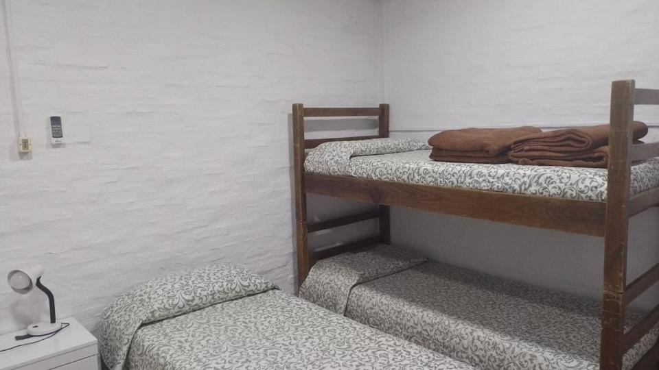 a room with two bunk beds in a room at Buena Vista in Salto