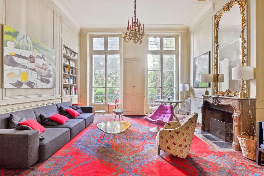 a living room with a couch and a fireplace at Splendid appartment in the heart of Paris - Welkeys in Paris