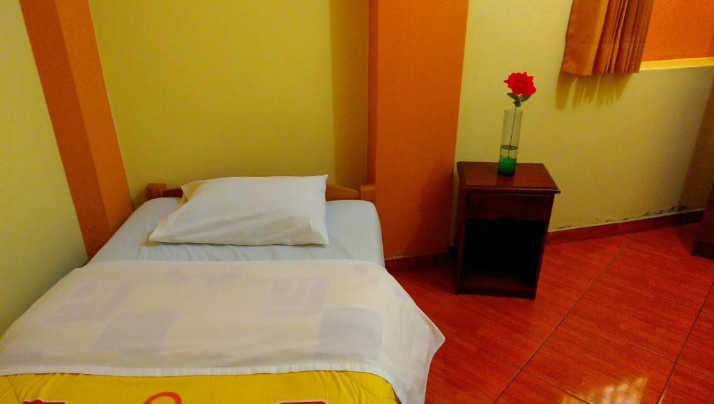 Postel nebo postele na pokoji v ubytování Musky Hs & Suites