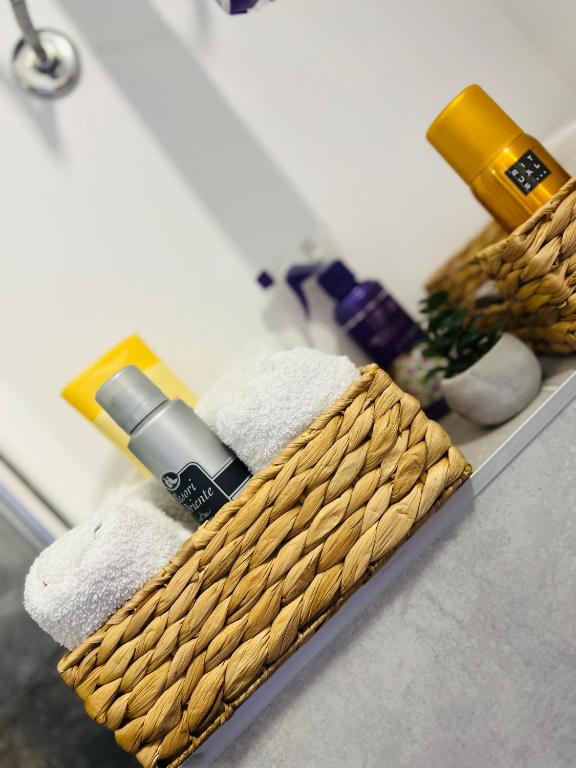 a basket with a bottle of soap and towels at Golden joy in Sarajevo